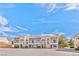Charming multi-unit home with Spanish-style roofing and balconies under a bright blue sky at 1201 Bourbon St, Pahrump, NV 89048