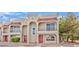 Close up of a multi-unit home with Spanish-style roofing, arched windows and doors at 1201 Bourbon St, Pahrump, NV 89048