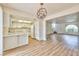 Bright kitchen with white cabinetry, appliances and an open view of the living area at 1201 Bourbon St, Pahrump, NV 89048
