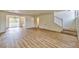 Inviting living room features wood-style floors, staircase and bright natural light at 1201 Bourbon St, Pahrump, NV 89048