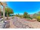 Backyard showcasing water feature, mature landscaping, and seating area at 1641 Rockcrest Hills Ave, Henderson, NV 89052