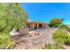 Expansive backyard featuring a covered patio, water feature, and mature landscaping at 1641 Rockcrest Hills Ave, Henderson, NV 89052