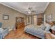 Spacious bedroom with hardwood floors, ceiling fan, and classic furnishings and decor at 1641 Rockcrest Hills Ave, Henderson, NV 89052