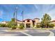 Inviting clubhouse entrance with flags and landscaped roundabout offers a warm welcome at 1641 Rockcrest Hills Ave, Henderson, NV 89052
