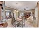 Elegant dining area adjacent to the living room, featuring a chandelier and a decorative china cabinet at 1641 Rockcrest Hills Ave, Henderson, NV 89052