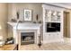 Elegant fireplace with custom built-ins and TV space for a cozy living area at 1641 Rockcrest Hills Ave, Henderson, NV 89052