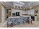 Bright kitchen features skylight, white cabinets, and a blue island with bar stool seating at 1641 Rockcrest Hills Ave, Henderson, NV 89052