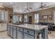 Open concept kitchen island with gas cooktop, stylish cabinets, and seating area at 1641 Rockcrest Hills Ave, Henderson, NV 89052