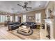 Comfortable living room with fireplace, crown moulding, and tile floors at 1641 Rockcrest Hills Ave, Henderson, NV 89052