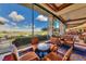 Cozy sitting area with floor to ceiling windows and comfortable seating overlooking the landscape at 1641 Rockcrest Hills Ave, Henderson, NV 89052