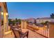 Charming balcony with comfortable seating and ambient string lights, creating a relaxing outdoor retreat at 1717 Jake Andrew Ave, North Las Vegas, NV 89086