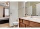 Practical bathroom featuring a vanity with a wood cabinet and an enclosed shower with modern fixtures at 1717 Jake Andrew Ave, North Las Vegas, NV 89086