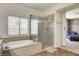 Bathroom featuring a shower, soaking tub, and natural light at 1717 Jake Andrew Ave, North Las Vegas, NV 89086
