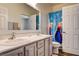 Bright bathroom features dual sinks, gray vanity and Frozen-themed shower curtain adding charm at 1717 Jake Andrew Ave, North Las Vegas, NV 89086
