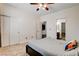 Bedroom with a ceiling fan, closet, and easy access to an adjacent bathroom offering practicality and privacy at 1717 Jake Andrew Ave, North Las Vegas, NV 89086