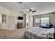 Spacious bedroom with natural light, television, and access to a balcony at 1717 Jake Andrew Ave, North Las Vegas, NV 89086