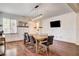 Dining room with wood floors, modern lighting, decorative wall paneling and large table at 1717 Jake Andrew Ave, North Las Vegas, NV 89086