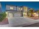 Two-story home boasts a three-car garage and well-maintained landscaping at 1717 Jake Andrew Ave, North Las Vegas, NV 89086
