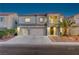 Stately two-story home with a three-car garage, desert landscaping, and a welcoming front entrance at 1717 Jake Andrew Ave, North Las Vegas, NV 89086