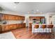 Open-concept kitchen offers a central island, ample counter space, and wood flooring at 1717 Jake Andrew Ave, North Las Vegas, NV 89086