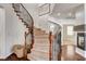 Elegant staircase with decorative iron railing and carpeted steps, adding a touch of sophistication to the home's interior at 1717 Jake Andrew Ave, North Las Vegas, NV 89086