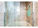 Bathroom featuring a shower-tub combo with glass doors and a built-in corner shelf at 1723 Candice St, Las Vegas, NV 89156