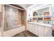 Bathroom featuring double vanity, tile shower, and modern fixtures at 1723 Candice St, Las Vegas, NV 89156