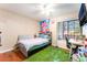 Cozy bedroom with a window view, a ceiling fan and hardwood-look flooring at 1723 Candice St, Las Vegas, NV 89156