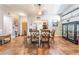 A dining room featuring tile floors, a wood table, and natural lighting at 1723 Candice St, Las Vegas, NV 89156