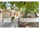 Welcoming front entrance with white siding, neat landscaping, and decorative details at 1723 Candice St, Las Vegas, NV 89156