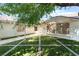 Charming single-story home with a well-maintained front yard and lovely artificial grass at 1723 Candice St, Las Vegas, NV 89156