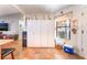 Spacious kitchen features tile flooring, window, and extensive white cabinets for ample storage at 1723 Candice St, Las Vegas, NV 89156