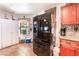 Bright kitchen with stainless steel refrigerator, tile floors, and ample storage space at 1723 Candice St, Las Vegas, NV 89156