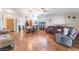 Open-concept living room featuring tile floors, a fireplace, and ample seating at 1723 Candice St, Las Vegas, NV 89156