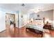Comfortable main bedroom with hardwood floors, ceiling fan, and neutral paint at 1723 Candice St, Las Vegas, NV 89156