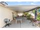 Extended covered patio with ample seating and views of the backyard at 1723 Candice St, Las Vegas, NV 89156