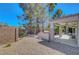 Inviting backyard with a built-in barbecue, covered patio, and low-maintenance desert landscaping at 2059 Joy View Ln, Henderson, NV 89012