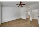 Spacious bedroom featuring ceiling fan and an ensuite bathroom at 2059 Joy View Ln, Henderson, NV 89012