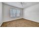 A bright bedroom featuring tile flooring and a ceiling fan for added comfort at 2059 Joy View Ln, Henderson, NV 89012