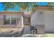Close-up view of the front door and address of the home, complimented by desert landscaping and a tiled roof at 2059 Joy View Ln, Henderson, NV 89012