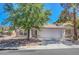 Charming single-story home featuring a two-car garage, mature tree, and well-maintained front yard in a quiet neighborhood at 2059 Joy View Ln, Henderson, NV 89012