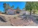 Well-maintained home with a two-car garage, desert landscaping, and inviting curb appeal at 2059 Joy View Ln, Henderson, NV 89012
