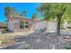 Charming house with a two-car garage, desert landscaping, and a well-maintained front exterior at 2059 Joy View Ln, Henderson, NV 89012