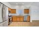 Well-lit kitchen with stainless steel appliances, cabinetry, and tile flooring at 2059 Joy View Ln, Henderson, NV 89012