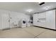 Large laundry room in the garage area featuring washer, dryer, sink, and ample storage at 2059 Joy View Ln, Henderson, NV 89012