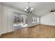 Bright living room featuring sliding glass doors opening to a patio and backyard at 2059 Joy View Ln, Henderson, NV 89012