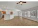 Bright living space with tile flooring, stainless steel appliances in the kitchen, and ample windows for natural light at 2059 Joy View Ln, Henderson, NV 89012