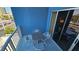 Cozy balcony with table, chairs and city view at 211 E Flamingo Rd # 405, Las Vegas, NV 89169
