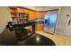 Compact kitchen with stainless steel appliances, granite countertops, and maple cabinetry at 211 E Flamingo Rd # 405, Las Vegas, NV 89169