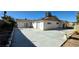 Spacious backyard area featuring a large concrete patio and mature trees at 2112 Los Altos St, Las Vegas, NV 89102